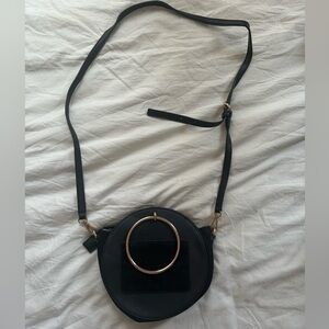 Black crossbody bag with rose gold hardware